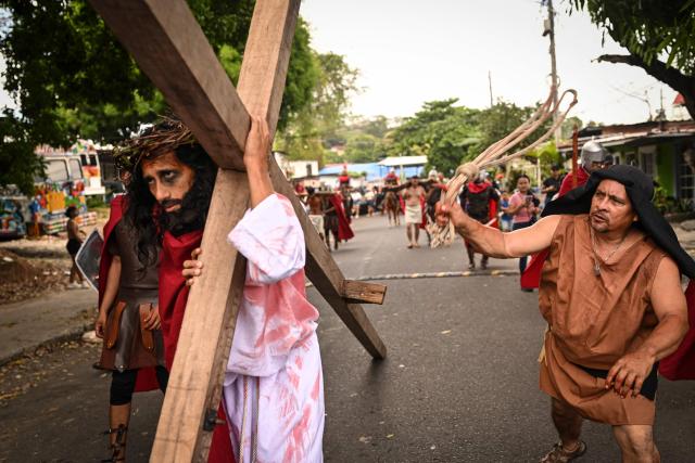 A man portrays Jesus Christ during the Good Friday procession in Panama City on April 03, 2026. (Photo by MARTIN BERNETTI / AFP)