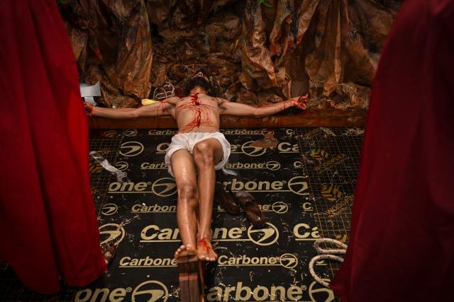 A man portrays Jesus Christ during the Good Friday procession in Panama City on April 03, 2026. (Photo by MARTIN BERNETTI / AFP)