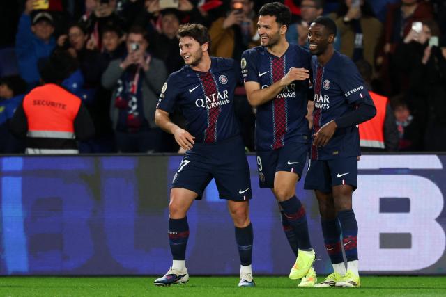 Paris Saint-Germain's Portuguese forward #09 Goncalo Ramos (C) celebrates with teammates  Paris Saint-Germain's Portuguese midfielder #87 Joao Neves (L) and Paris Saint-Germain's French forward #10 Ousmane Dembele after scoring his team's third goal during the French L1 football match between Paris Saint-Germain (PSG) and Toulouse FC at the Parc des Princes stadium in Paris on April 3, 2026. (Photo by Anne-Christine POUJOULAT / AFP)