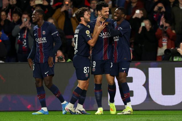 Paris Saint-Germain's Portuguese forward #09 Goncalo Ramos (C) celebrates with teammates Paris Saint-Germain's Portuguese defender #25 Nuno Mendes (L) Paris Saint-Germain's Portuguese midfielder #87 Joao Neves (2nd L) and Paris Saint-Germain's French forward #10 Ousmane Dembele after scoring his team's third goal during the French L1 football match between Paris Saint-Germain (PSG) and Toulouse FC at the Parc des Princes stadium in Paris on April 3, 2026. (Photo by Anne-Christine POUJOULAT / AFP)
