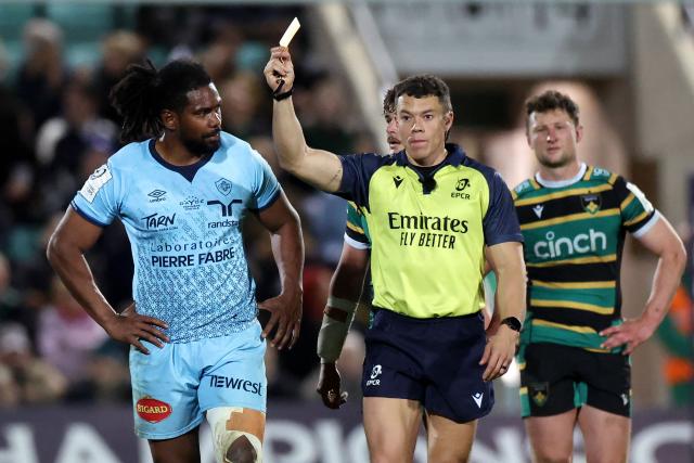 Castres' Fijian number 8 Veresa Ramototabua is shown a yellow card by Referee Craig Evans during the European Rugby Champions Cup round of 16 rugby union match, between Northampton Saints and Castres Olympique at Franklin's Gardens in Northampton, central England, on April 3, 2026. (Photo by Darren Staples / AFP)