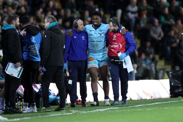 Castres' Fijian wing Vuate Karawalevu leaves the pitch injured during the European Rugby Champions Cup round of 16 rugby union match, between Northampton Saints and Castres Olympique at Franklin's Gardens in Northampton, central England, on April 3, 2026. (Photo by Darren Staples / AFP)