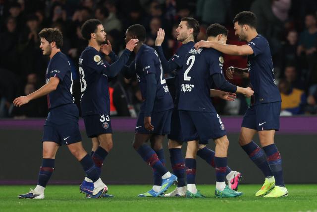 Paris Saint-Germain's Portuguese forward #09 Goncalo Ramos (R) celebrates with teammates  after scoring his team's third goal during the French L1 football match between Paris Saint-Germain (PSG) and Toulouse FC at the Parc des Princes stadium in Paris on April 3, 2026. (Photo by Anne-Christine POUJOULAT / AFP)