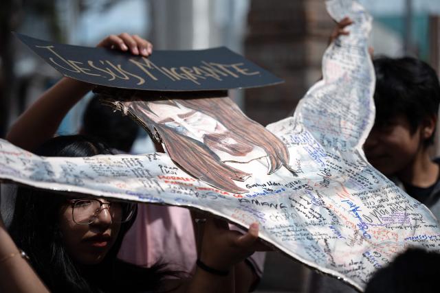Migrants and advocates participate in the Migrant Walk of the Cross as part of the Holy Week celebrations in Tijuana, Baja California state, Mexico, on April 3, 2026. (Photo by Guillermo Arias / AFP)