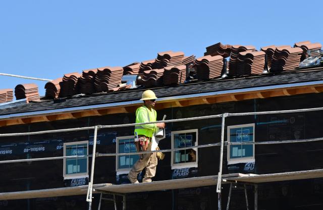 (FILES) A construction worker works at a new house being built in Alhambra, California, on March 19, 2026. The US economy posted unexpectedly strong job gains in March, data showed on April 3, 2026, in a development hailed by US President Donald Trump -- but seen with caution by analysts. The world's largest economy gained 178,000 jobs in March, after losing 133,000 in February, and the unemployment rate dropped by 0.1 percentage points to 4.3 percent, the Labor Department said. (Photo by Frederic J. BROWN / AFP)