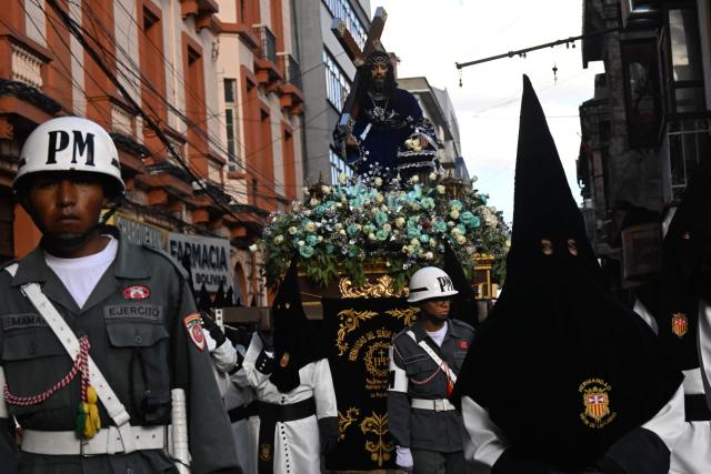 Members of the Brotherhood of the Lord of the Sentencing take part in the Good Friday procession during the Holy Week in La Paz on April 3, 2026. (Photo by AIZAR RALDES / AFP)