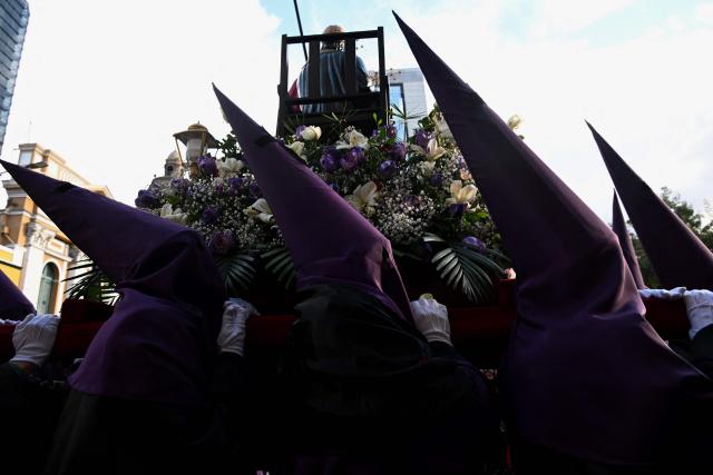 Members of the Brotherhood of the Lord of the Sentencing take part in the Good Friday procession during the Holy Week in La Paz on April 3, 2026. (Photo by AIZAR RALDES / AFP)