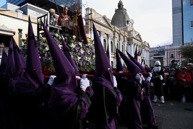 Members of the Brotherhood of the Lord of the Sentencing take part in the Good Friday procession during the Holy Week in La Paz on April 3, 2026. (Photo by AIZAR RALDES / AFP)