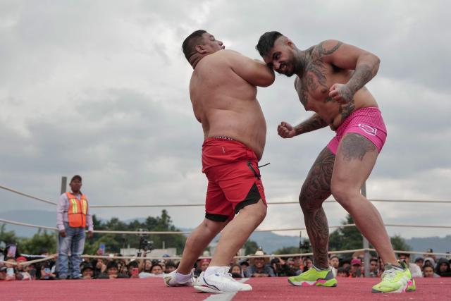Competitors fight during a traditional boxing tournament which commemorates Good Friday and the crucifixion of Jesus in Chivarreto, Totonicapan department, 205 km west of Guatemala City, on April 3, 2026.  (Photo by Edwin BERCIAN / AFP)