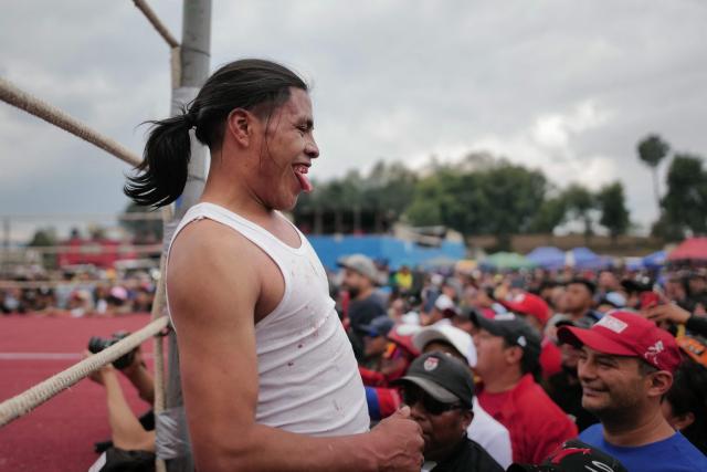 A competitor gestures during a traditional boxing tournament which commemorates Good Friday and the crucifixion of Jesus in Chivarreto, Totonicapan department, 205 km west of Guatemala City, on April 3, 2026.  (Photo by Edwin BERCIAN / AFP)