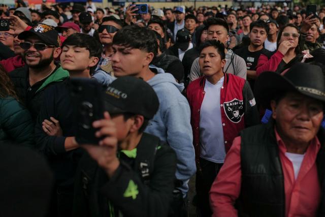 Spectators watch as competitors fight during a traditional boxing tournament which commemorates Good Friday and the crucifixion of Jesus in Chivarreto, Totonicapan department, 205 km west of Guatemala City, on April 3, 2026.  (Photo by Edwin BERCIAN / AFP)