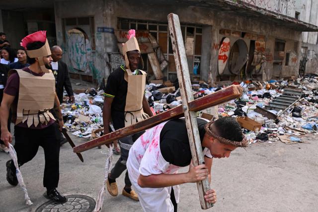 Youngsters enact the Passion of Jesus Christ during a procession marking the Way of the Cross on Good Friday in Havana on April 3, 2026. (Photo by YAMIL LAGE / AFP)