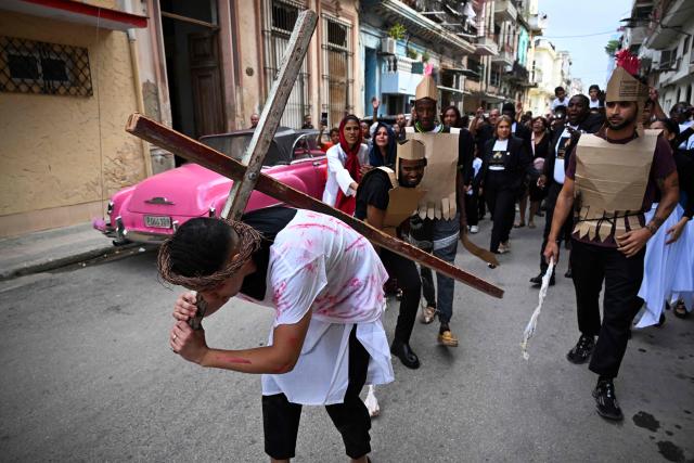 TOPSHOT - Youngsters enact the Passion of Jesus Christ during a procession marking the Way of the Cross on Good Friday in Havana on April 3, 2026. (Photo by YAMIL LAGE / AFP)