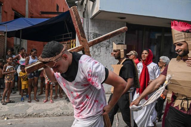 Youngsters enact the Passion of Jesus Christ during a procession marking the Way of the Cross on Good Friday in Havana on April 3, 2026. (Photo by YAMIL LAGE / AFP)