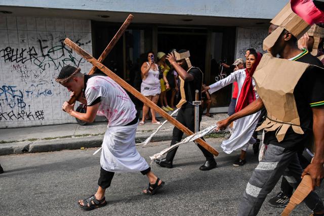 Youngsters enact the Passion of Jesus Christ during a procession marking the Way of the Cross on Good Friday in Havana on April 3, 2026. (Photo by YAMIL LAGE / AFP)