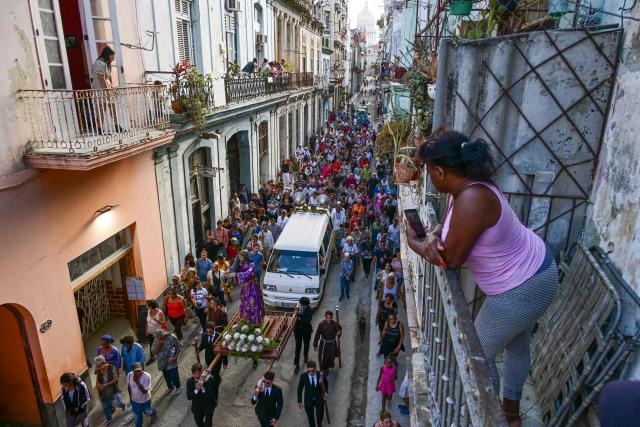 TOPSHOT - Catholic faithful take part in the Via Crucis (Way of the Cross) on Good Friday during Holy Week in Havana on April 3, 2026. (Photo by YAMIL LAGE / AFP)