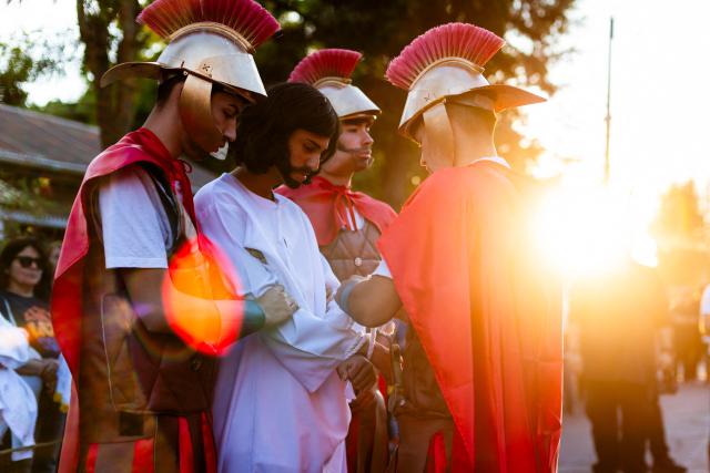 Youngsters from the Sacred Heart of Jesus Parish enact the Passion of Jesus Christ during Via Crusis (Way of the Cross) on Good Friday in Colina, Chile on April 3, 2026. (Photo by Javier TORRES / AFP)