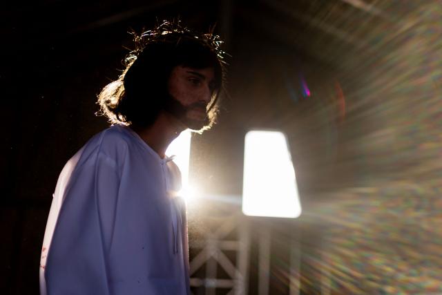 A youngster from the Sacred Heart of Jesus Parish enacts the Passion of Jesus Christ during Via Crusis (Way of the Cross) on Good Friday in Colina, Chile on April 3, 2026. (Photo by Javier TORRES / AFP)