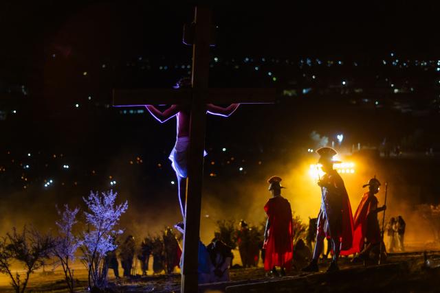 Youngsters from the Sacred Heart of Jesus Parish enact the Passion of Jesus Christ during Via Crusis (Way of the Cross) on Good Friday in Colina, Chile on April 3, 2026. (Photo by Javier TORRES / AFP)