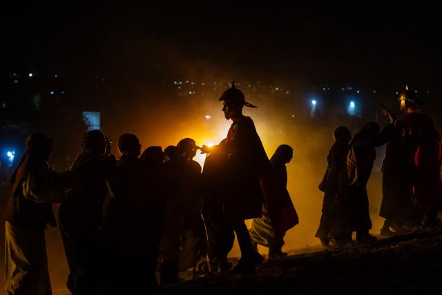 Youngsters from the Sacred Heart of Jesus Parish enact the Passion of Jesus Christ during Via Crusis (Way of the Cross) on Good Friday in Colina, Chile on April 3, 2026. (Photo by Javier TORRES / AFP)