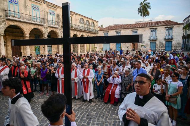 Catholic faithful take part in the Via Crucis (Way of the Cross) on Good Friday during Holy Week in Havana on April 3, 2026. (Photo by YAMIL LAGE / AFP)