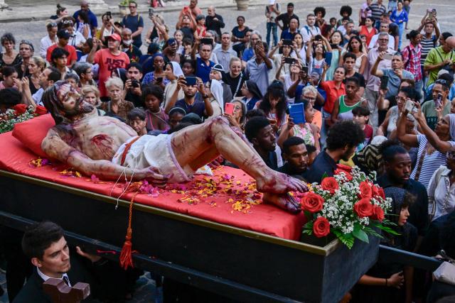 Catholic faithful take part in the Via Crucis (Way of the Cross) on Good Friday during Holy Week in Havana on April 3, 2026. (Photo by YAMIL LAGE / AFP)