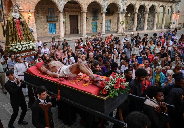 Catholic faithful take part in the Jesus Via Crucis (Way of the Cross) during Good Friday in Havana on April 3, 2026. (Photo by YAMIL LAGE / AFP)