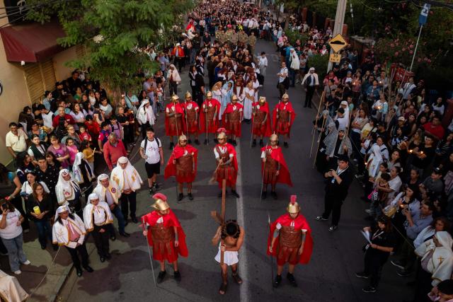 Youngsters from the Sacred Heart of Jesus Parish enact the Passion of Jesus Christ during Via Crusis (Way of the Cross) on Good Friday in Colina, Chile on April 3, 2026. (Photo by Javier TORRES / AFP)
