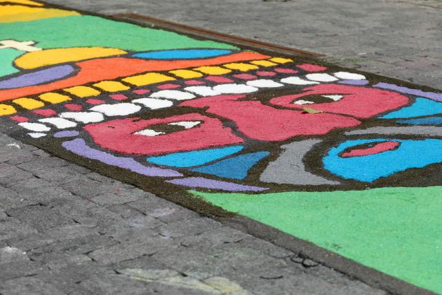 View of a salt carpet of over one kilometer, considered the largest in Central America, during Holy Week celebrations in the historic center of San Salvador, on March 3, 2026. (Photo by Marvin RECINOS / AFP)