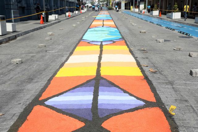 View of a salt carpet of over one kilometer, considered the largest in Central America, during Holy Week celebrations in the historic center of San Salvador, on March 3, 2026. (Photo by Marvin RECINOS / AFP)