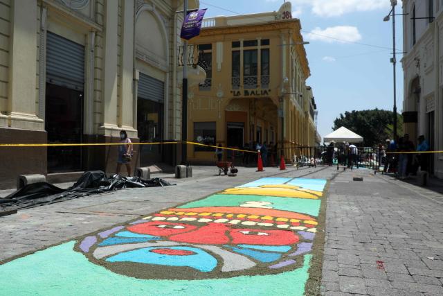 View of a salt carpet of over one kilometer, considered the largest in Central America, during Holy Week celebrations in the historic center of San Salvador, on March 3, 2026. (Photo by Marvin RECINOS / AFP)