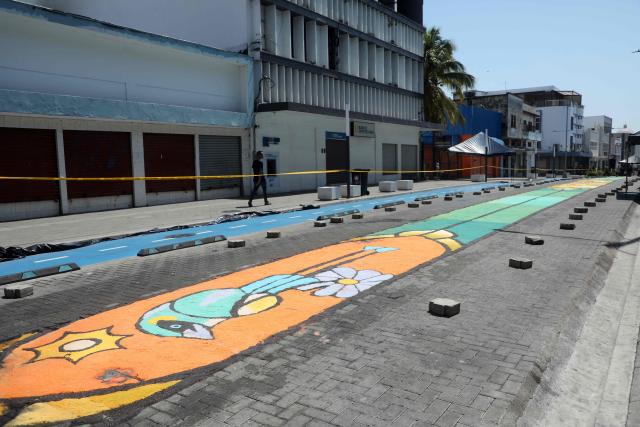 View of a salt carpet of over one kilometer, considered the largest in Central America, during Holy Week celebrations in the historic center of San Salvador, on March 3, 2026. (Photo by Marvin RECINOS / AFP)