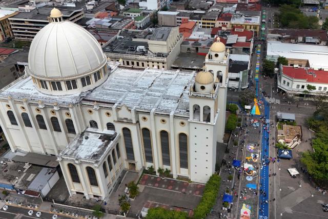 This aerial view shows a salt carpet of over one kilometer, considered the largest in Central America, during Holy Week celebrations in the historic center of San Salvador on April 3, 2026. (Photo by Marvin RECINOS / AFP)