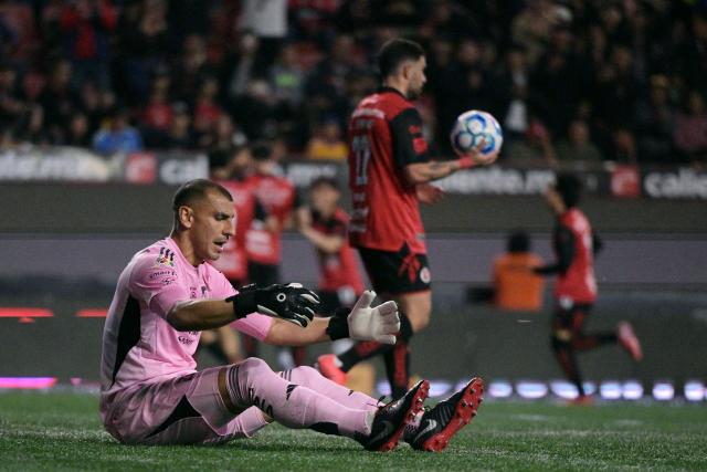 Tigres' Argentine goalkeeper #01 Nahuel Guzman reacts after the opening goal scored by Tijuana's midfielder #10 Kevin Castaneda (unseen) during the Liga MX Clausura football match between Tijuana and Tigres at Caliente stadium in Tijuana, Mexico on April 3, 2026. (Photo by Guillermo Arias / AFP)