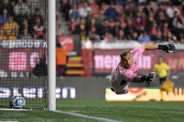 Tigres' Argentine goalkeeper #01 Nahuel Guzman fails to save a goal scored by Tijuana's midfielder #10 Kevin Castaneda (out of frame) during the Liga MX Clausura football match between Tijuana and Tigres at Caliente stadium in Tijuana, Mexico on April 3, 2026. (Photo by Guillermo Arias / AFP)