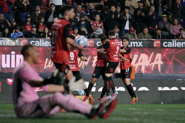 Tijuana's midfielder #10 Kevin Castaneda (3rd-R) celebrates with teammates after scoring the opening goal during the Liga MX Clausura football match between Tijuana and Tigres at Caliente stadium in Tijuana, Mexico on April 3, 2026. (Photo by Guillermo Arias / AFP)