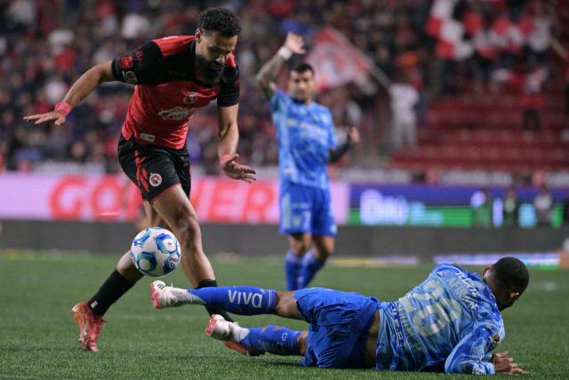 Tijuana's Spanish forward #09 Mourad El Ghezouani and Tigres' Brazilian defender #28 Joaquim Henrique fight for the ball during the Liga MX Clausura football match between Tijuana and Tigres at Caliente stadium in Tijuana, Mexico on April 3, 2026. (Photo by Guillermo Arias / AFP)