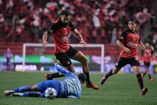 Tijuana's Spanish forward #09 Mourad El Ghezouani and Tigres' Brazilian defender #28 Joaquim Henrique fight for the ball during the Liga MX Clausura football match between Tijuana and Tigres at Caliente stadium in Tijuana, Mexico on April 3, 2026. (Photo by Guillermo Arias / AFP)