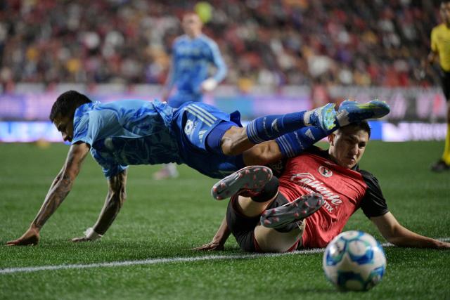 Tigres’ Uruguayan forward #17 Rodrigo Aguirre and Tijuana's defender #03 Rafael Inzunza fight for the ball during the Liga MX Clausura football match between Tijuana and Tigres at Caliente stadium in Tijuana, Mexico on April 3, 2026. (Photo by Guillermo Arias / AFP)