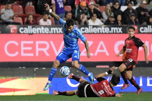 Tigres' Argentine forward #07 Angel Correa and Tijuana's midfielder #08 Ivan Tona fight for the ball during the Liga MX Clausura football match between Tijuana and Tigres at Caliente stadium in Tijuana, Mexico on April 3, 2026. (Photo by Guillermo Arias / AFP)