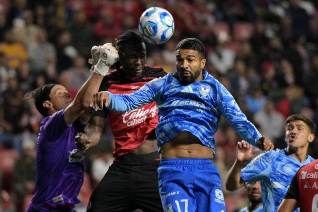 Tijuana's goalkeeper #02 Antonio Rodriguez, Tijuana's Ecuadorian defender #12 Jackson Porozo and Tigres’ Uruguayan forward #17 Rodrigo Aguirre fight for the ball during the Liga MX Clausura football match between Tijuana and Tigres at Caliente stadium in Tijuana, Mexico on April 3, 2026. (Photo by Guillermo Arias / AFP)