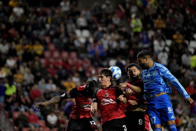 TOPSHOT - Tijuana's Spanish forward #09 Mourad El Ghezouani, defender #03 Rafael Inzunza, Ecuadorian defender #12 Jackson Porozo and Tigres’ Uruguayan forward #17 Rodrigo Aguirre fight for the ball during the Liga MX Clausura football match between Tijuana and Tigres at Caliente stadium in Tijuana, Mexico on April 3, 2026. (Photo by Guillermo Arias / AFP)