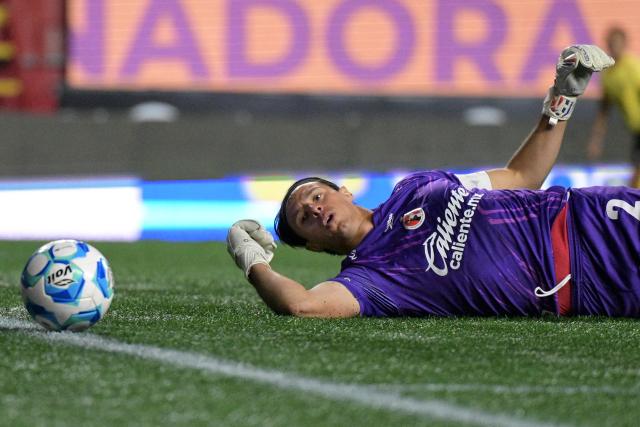 Tijuana's goalkeeper #02 Antonio Rodriguez eyes the ball after making a save during the Liga MX Clausura football match between Tijuana and Tigres at Caliente stadium in Tijuana, Mexico on April 3, 2026. (Photo by Guillermo Arias / AFP)