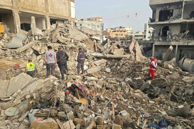 Rescue workers inspect the debris of destroyed buildings at the site of an Israeli strike in the southern Lebanese area of Maarakeh near the coastal city of Tyre on April 4, 2026. The Israeli military said on April 3, it had struck more than 3,500 targets across Lebanon in the month since fighting with Iran-backed Hezbollah militants. Lebanon was drawn into the Middle East war on March 2 when Hezbollah launched attacks on Israel to avenge the killing of the Iranian leader. Israel has responded with broad strikes across Lebanon and a ground offensive. (Photo by Kawnat HAJU / AFP)