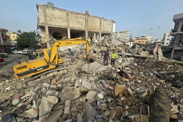 An excavator clears the rubble of destroyed buildings from site of an Israeli strike in the southern Lebanese area of Maarakeh near the coastal city of Tyre on April 4, 2026. The Israeli military said on April 3, it had struck more than 3,500 targets across Lebanon in the month since fighting with Iran-backed Hezbollah militants. Lebanon was drawn into the Middle East war on March 2 when Hezbollah launched attacks on Israel to avenge the killing of the Iranian leader. Israel has responded with broad strikes across Lebanon and a ground offensive. (Photo by Kawnat HAJU / AFP)