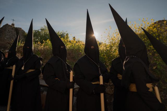 Penitents of the “Santo Entierro de Cristo” brotherhood take part in Good Friday procession in Ronda on April 3, 2026. Christian believers around the world mark the Holy Week of Easter in celebration of the crucifixion and resurrection of Jesus Christ. (Photo by JORGE GUERRERO / AFP)