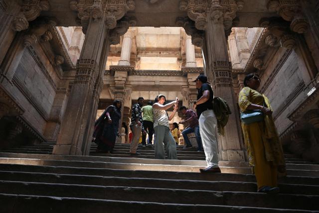 People visit the Rudabai Adalaj stepwell at Adalaj in Gandhinagar district, some 40 kms from Ahmedabad on April 4, 2026. (Photo by Shammi MEHRA / AFP)