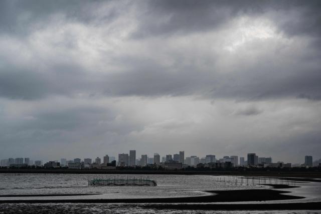 A view of the city from Kasai Rink park as a large storm moves over Tokyo on April 4, 2026. (Photo by ANDREW CABALLERO-REYNOLDS / AFP)