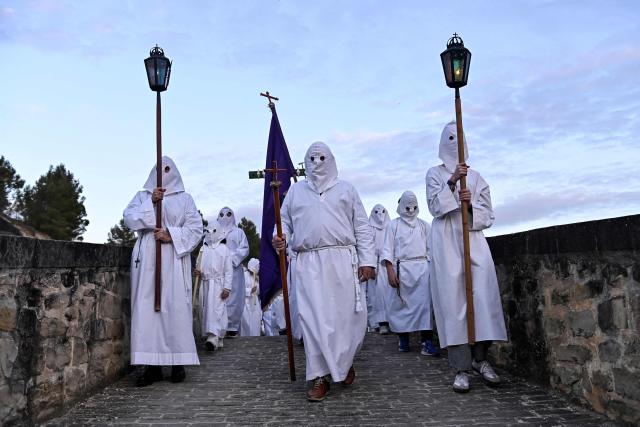 Penitents of La Vera Cruz brotherhood take part in the Good Friday procession in the Spanish Navarre village of Torres del Rio on April 3, 2026. Christian believers around the world mark the Holy Week of Easter in celebration of the crucifixion and resurrection of Jesus Christ. (Photo by ANDER GILLENEA / AFP)