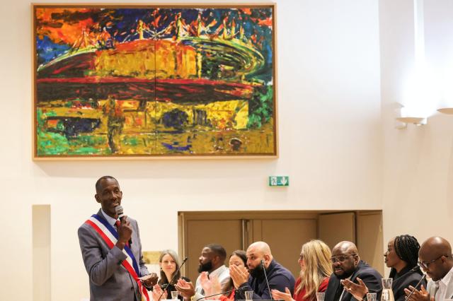 Saint-Denis Mayor Bally Bagayoko (L) delivers a speech during a municipal council meeting at the city hall in Saint-Denis, in the outskirts of Paris, on April 4, 2026. (Photo by Thomas SAMSON / AFP)